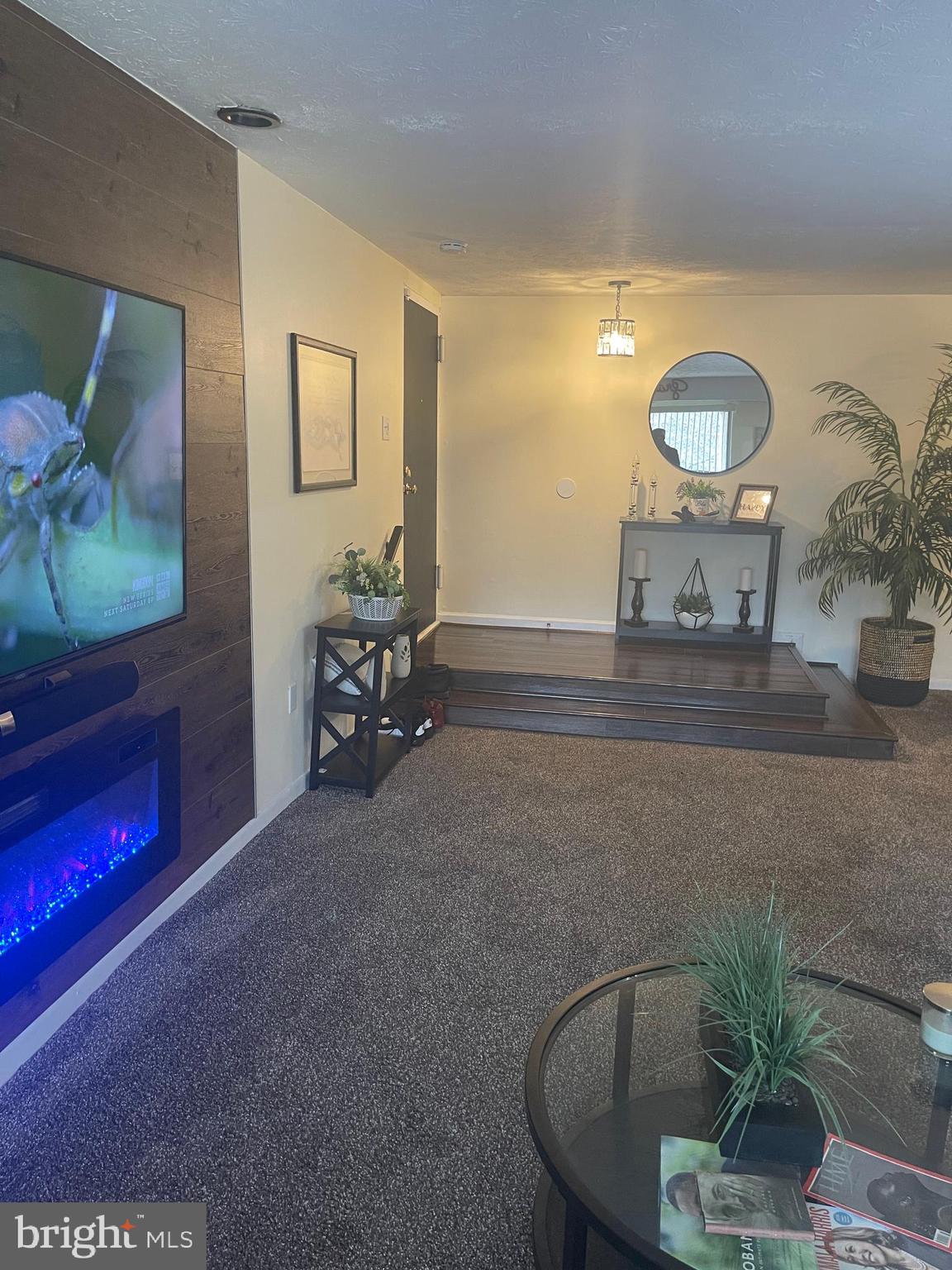 8015 Mandan Road, Unit 202 Greenbelt, MD 20770 - Photo 11 of 52 a living room with furniture and a floor to ceiling window