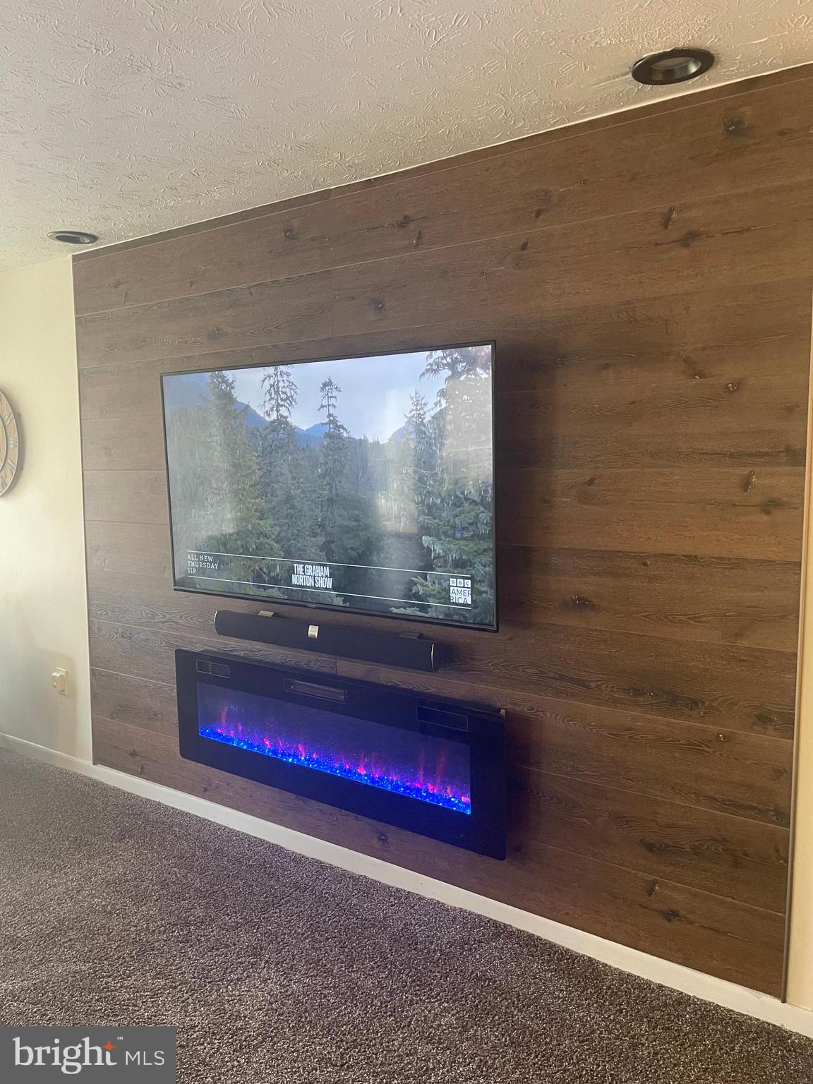 8015 Mandan Road, Unit 202 Greenbelt, MD 20770 - Photo 14 of 52 a room with a wooden floor and glass door
