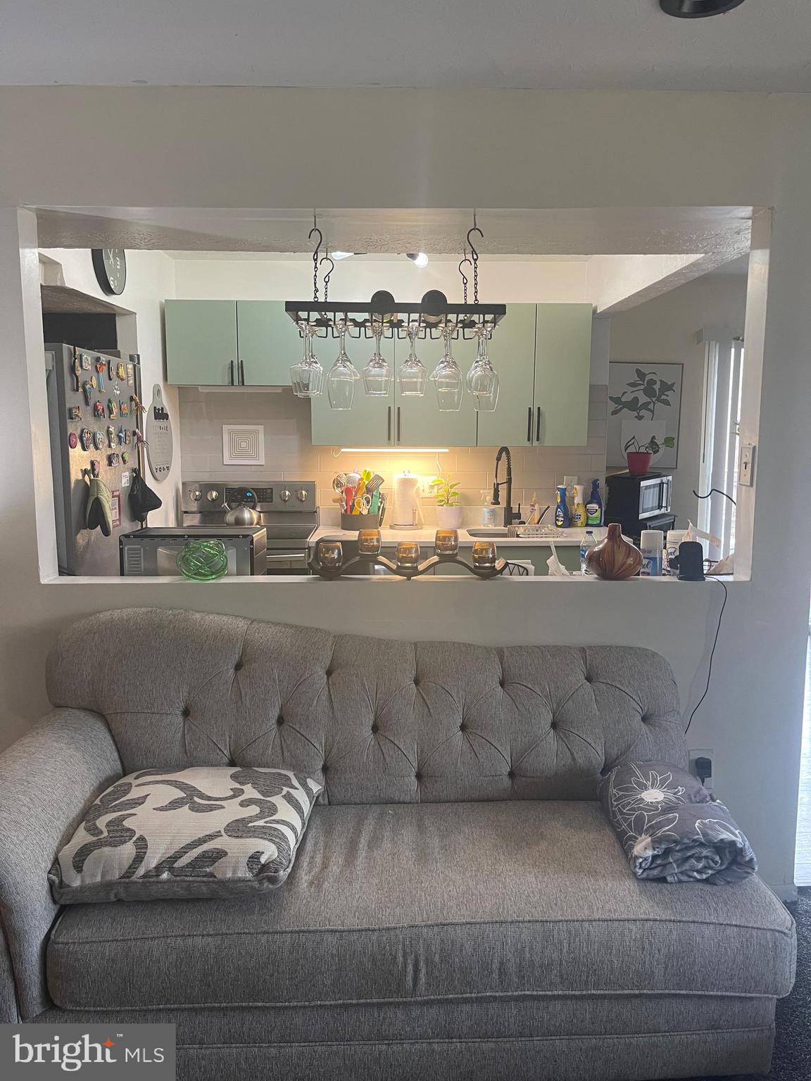 8015 Mandan Road, Unit 202 Greenbelt, MD 20770 - Photo 19 of 52 a living room with furniture and a wooden floor