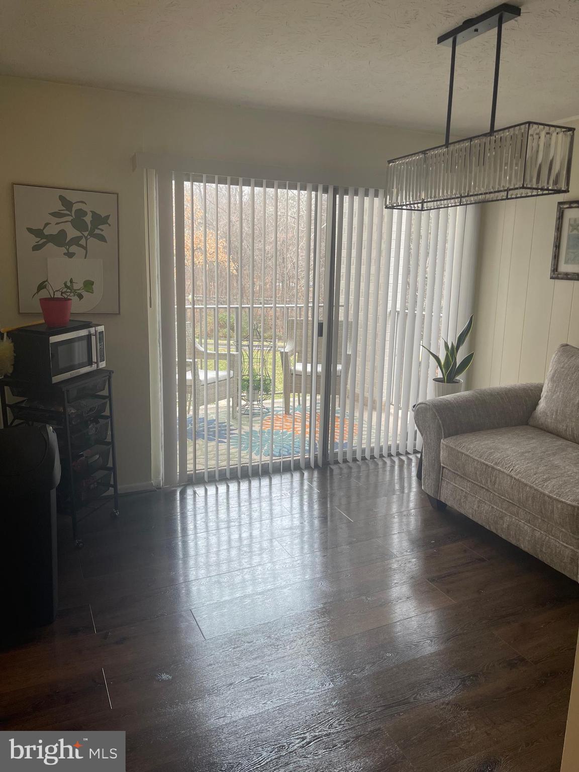 8015 Mandan Road, Unit 202 Greenbelt, MD 20770 - Photo 23 of 52 a living room with furniture and a gate