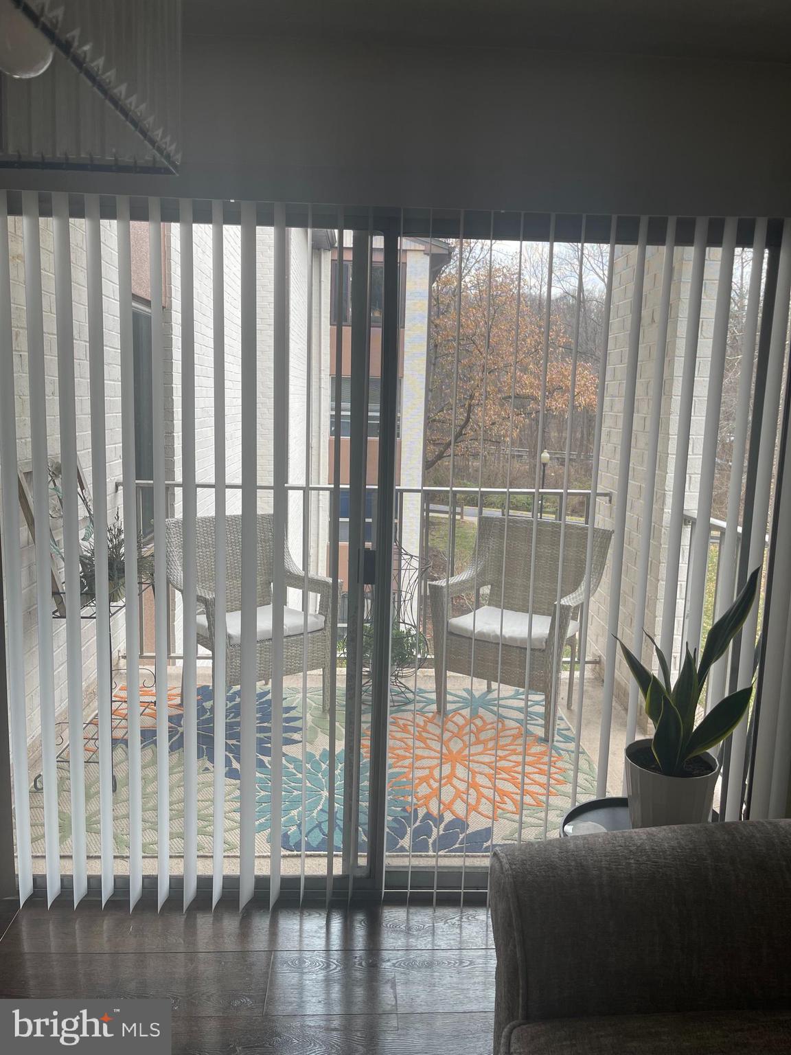 8015 Mandan Road, Unit 202 Greenbelt, MD 20770 - Photo 24 of 52 a view of a porch with a floor to ceiling window