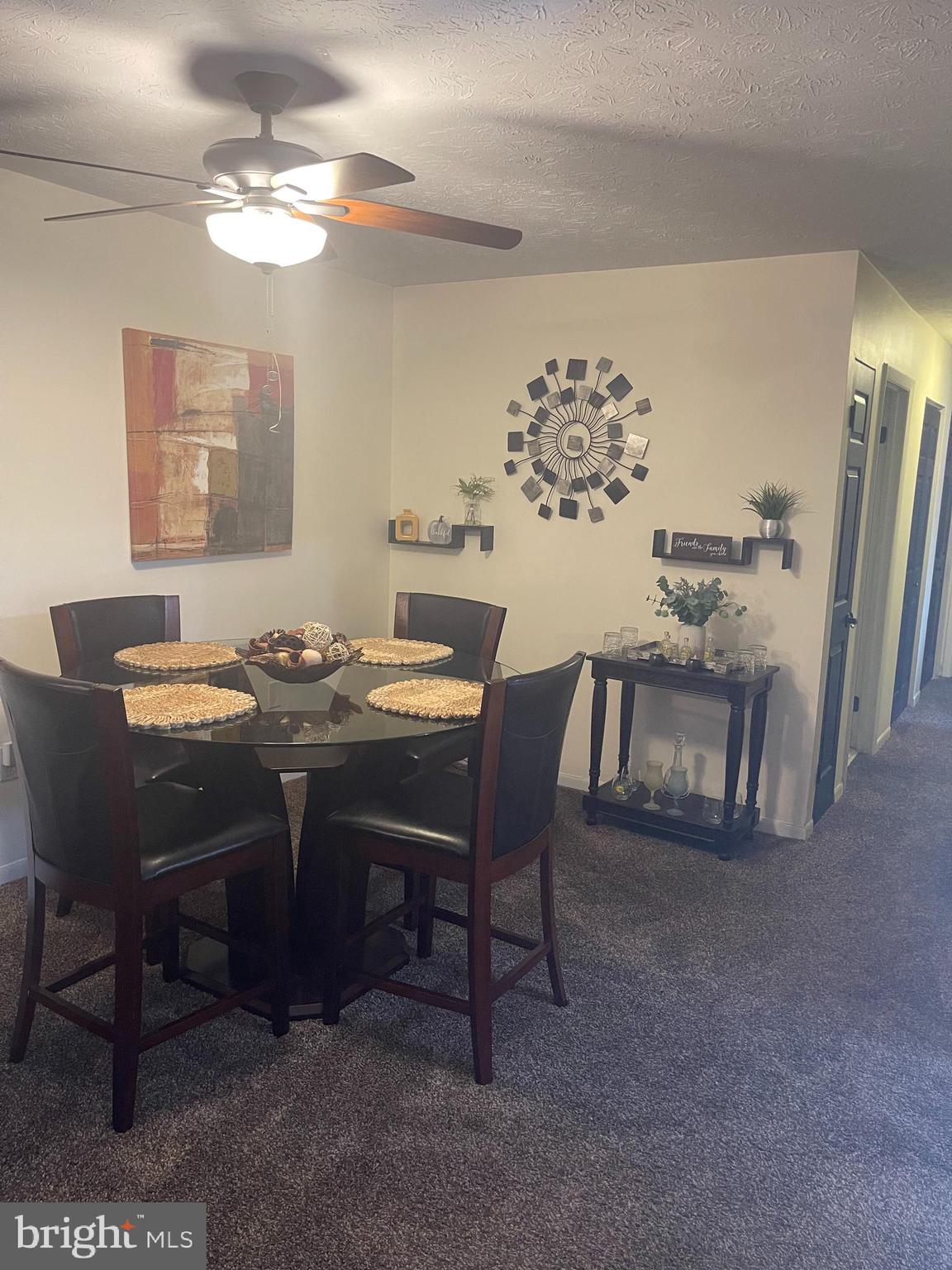 8015 Mandan Road, Unit 202 Greenbelt, MD 20770 - Photo 27 of 52 a view of a dining room with furniture and chandelier