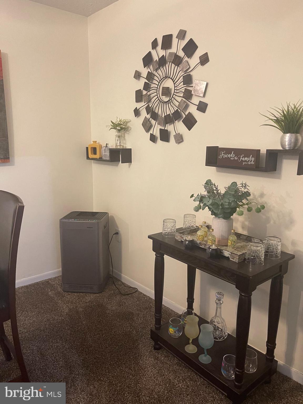 8015 Mandan Road, Unit 202 Greenbelt, MD 20770 - Photo 30 of 52 a table with a vase and a vase on it