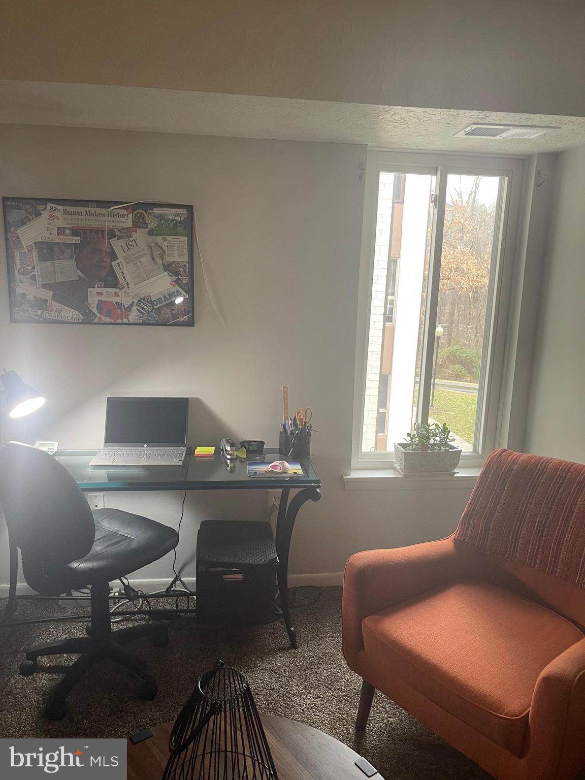 8015 Mandan Road, Unit 202 Greenbelt, MD 20770 - Photo 46 of 52 a living room with furniture and a window