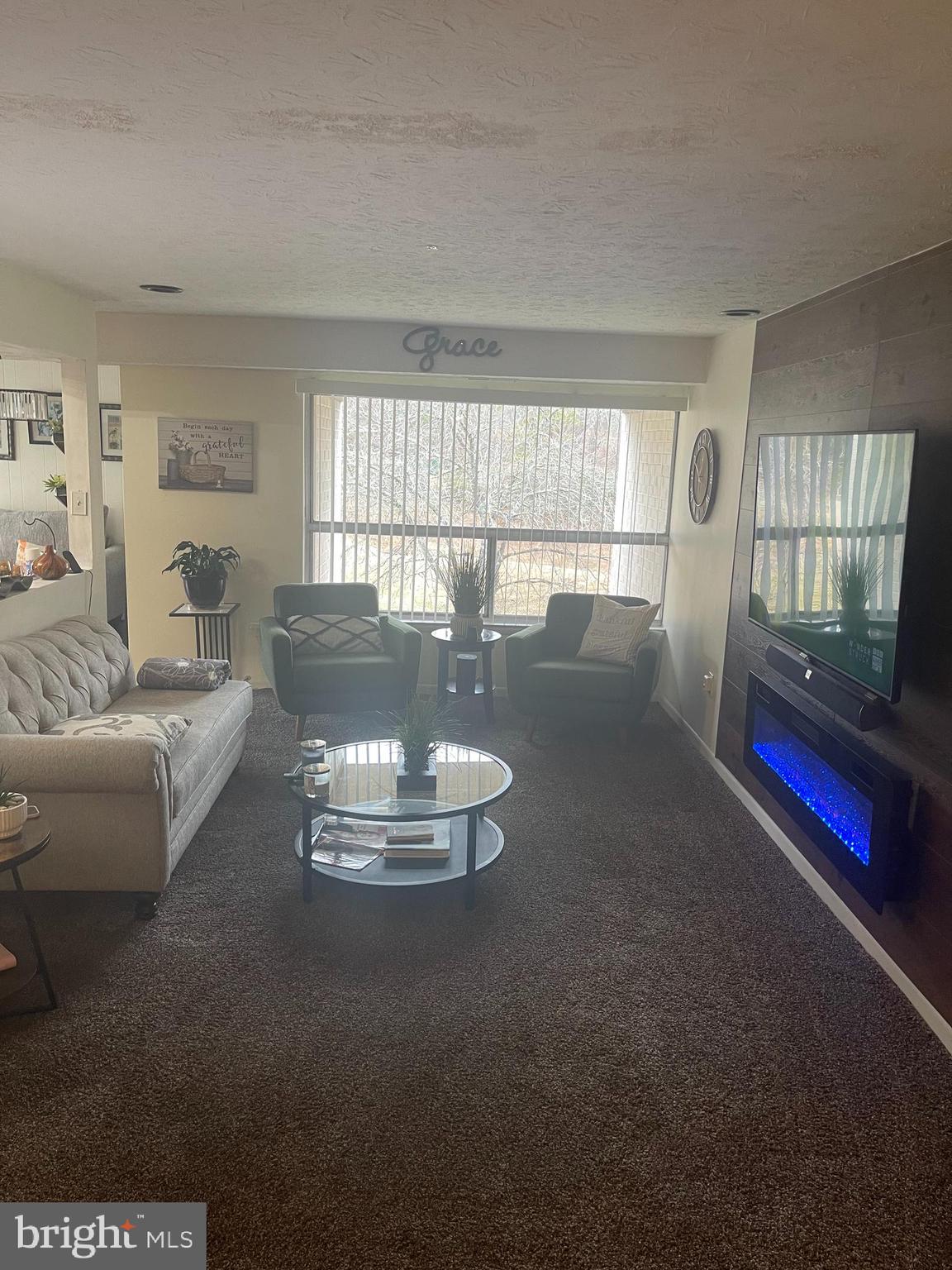 8015 Mandan Road, Unit 202 Greenbelt, MD 20770 - Photo 8 of 52 a living room with furniture and a large window