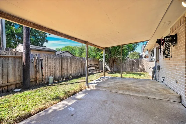 a view of backyard with green space
