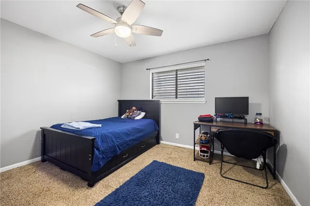 a bedroom with a workspace