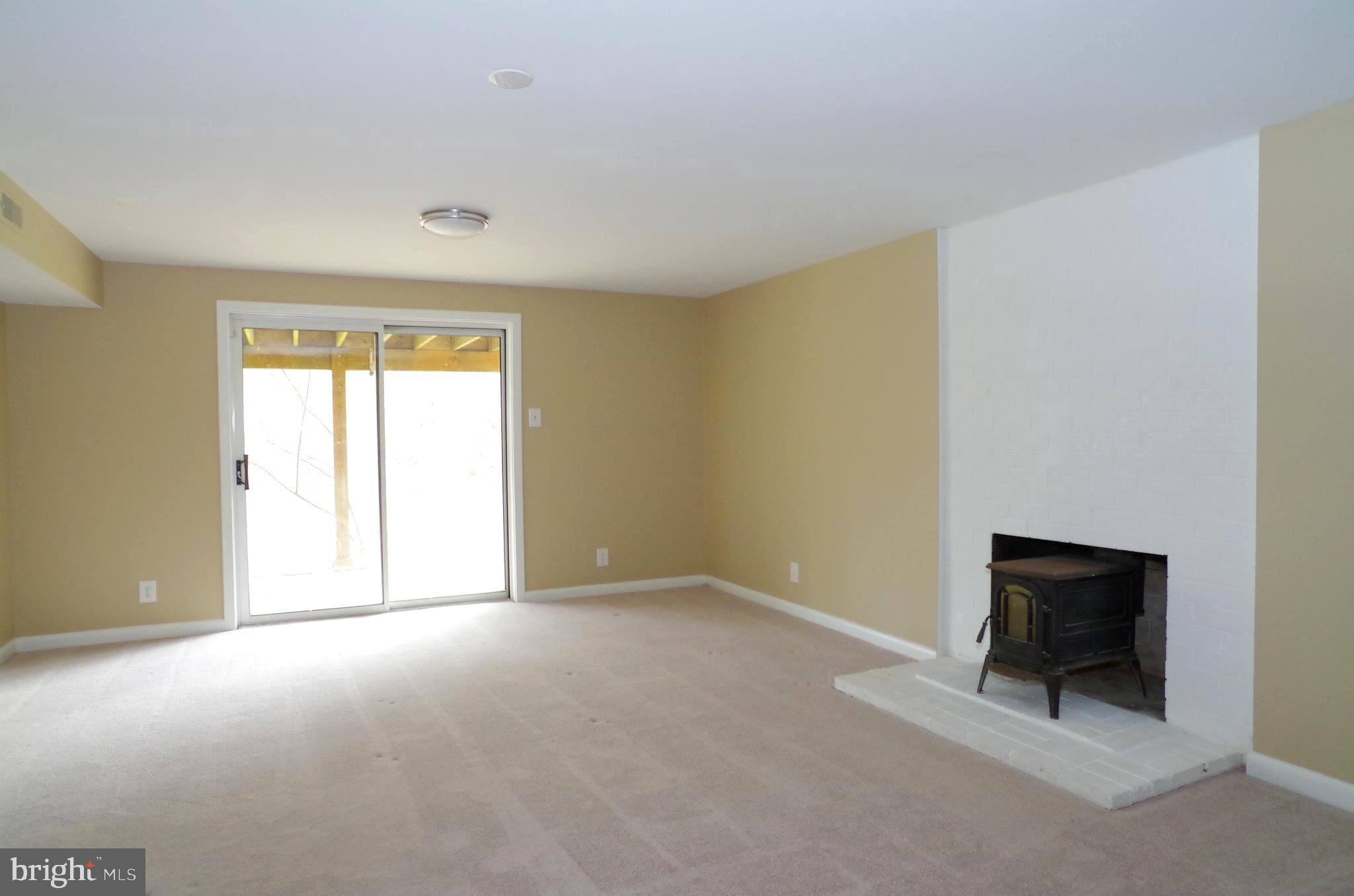 10929 Beach Mill Road Great Falls, VA 22066 - Photo 15 of 18 Recreation Room w/ Fireplace