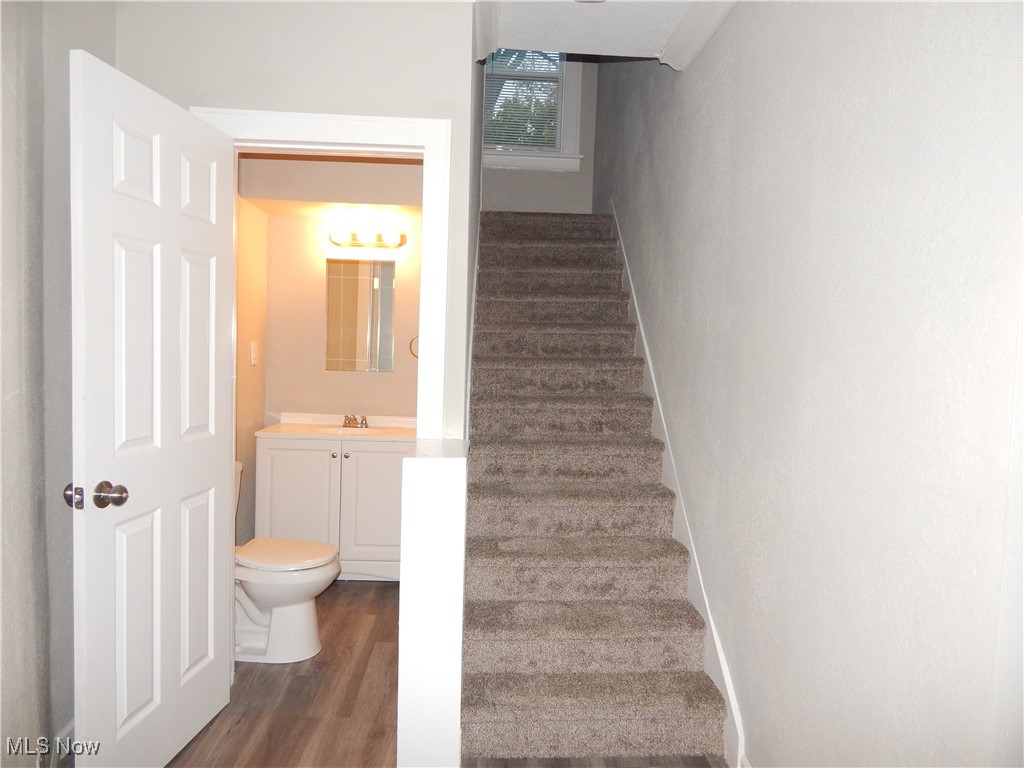 3845 Summit Park Road Cleveland Heights, OH 44121 - Photo 7 of 15 Stairway with baseboards and wood finished floors