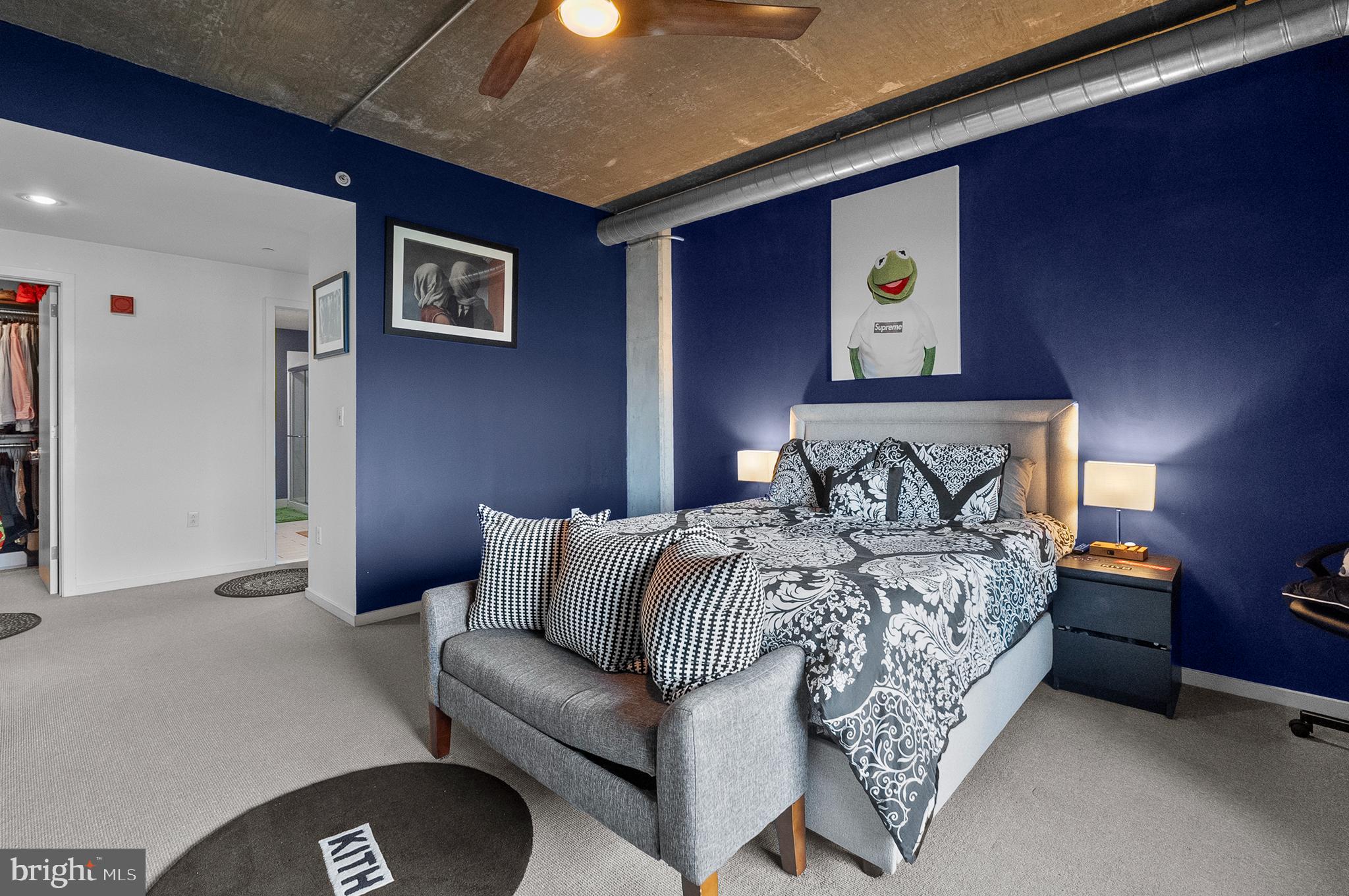 1200 Steuart Street, Unit 530 Baltimore, MD 21230 - Photo 14 of 38 a bedroom with bed and a couch