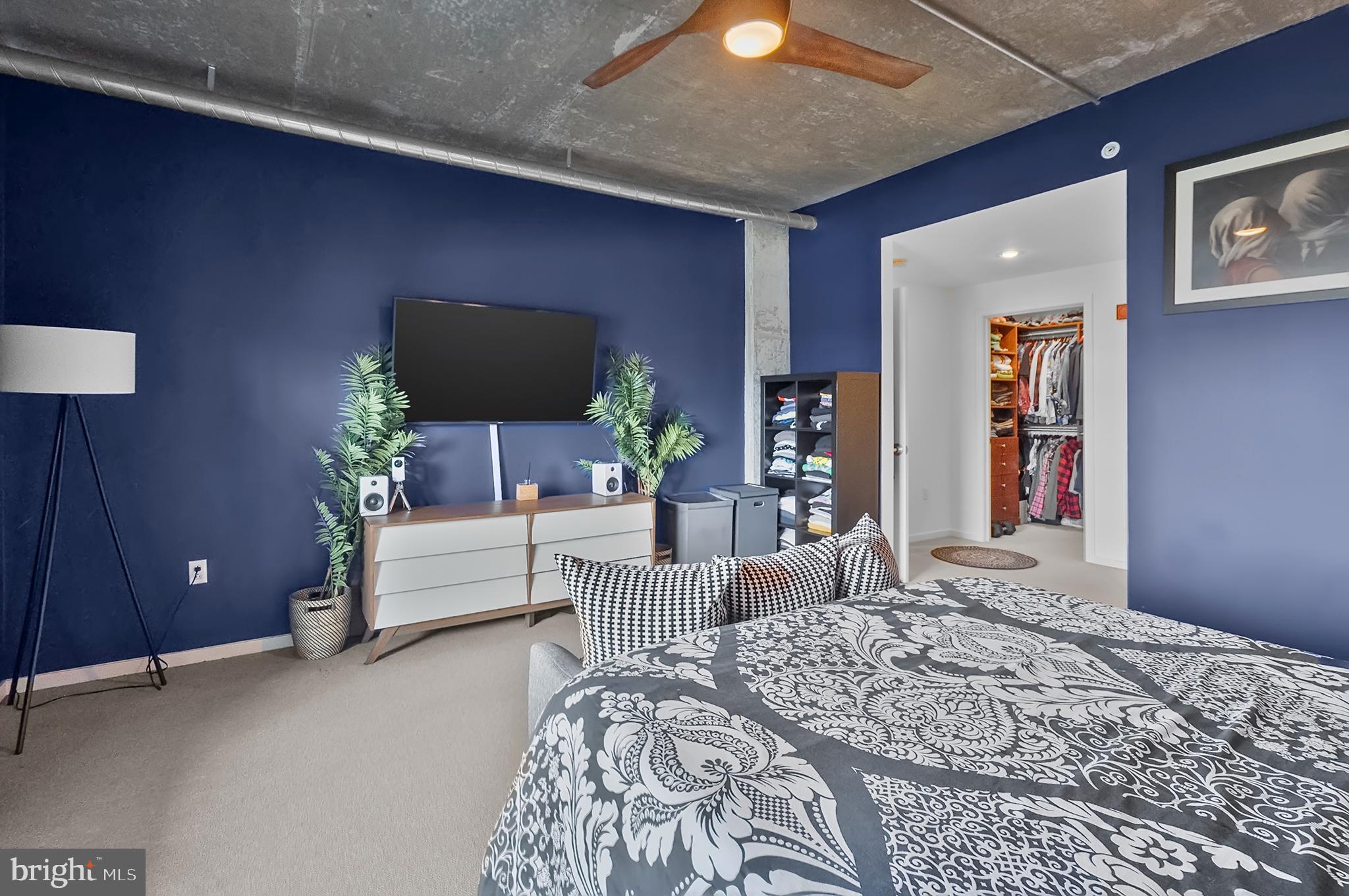 1200 Steuart Street, Unit 530 Baltimore, MD 21230 - Photo 15 of 38 a bedroom with a bed and a couch