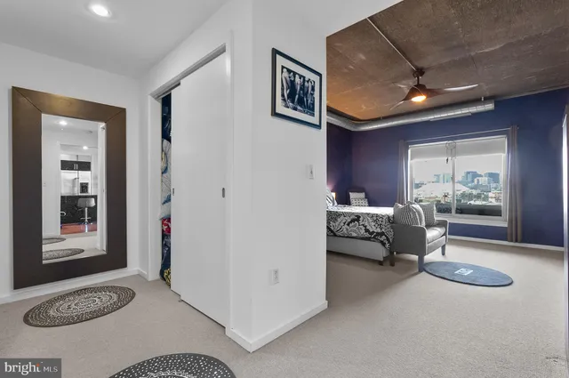 a bedroom with furniture and a window