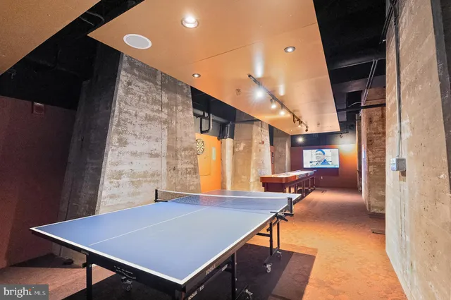 a view of a room with furniture and window