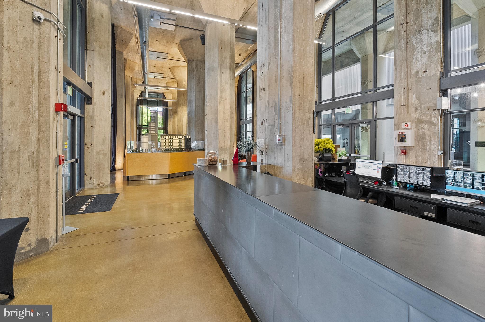 1200 Steuart Street, Unit 530 Baltimore, MD 21230 - Photo 33 of 38 a swimming pool with outdoor seating