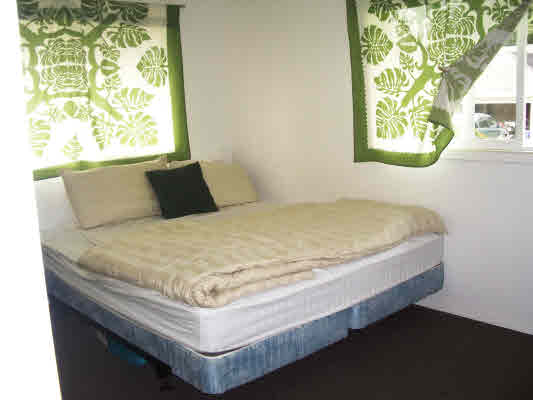 6685 Puupilo Road Kapaa, HI 96746 - Photo 23 of 25 a bed sitting in a bedroom next to a window