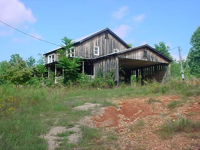 1540 Waidsboro Road Ferrum, VA 24088 - Photo 1 of 7 a front view of a house with yard and trees