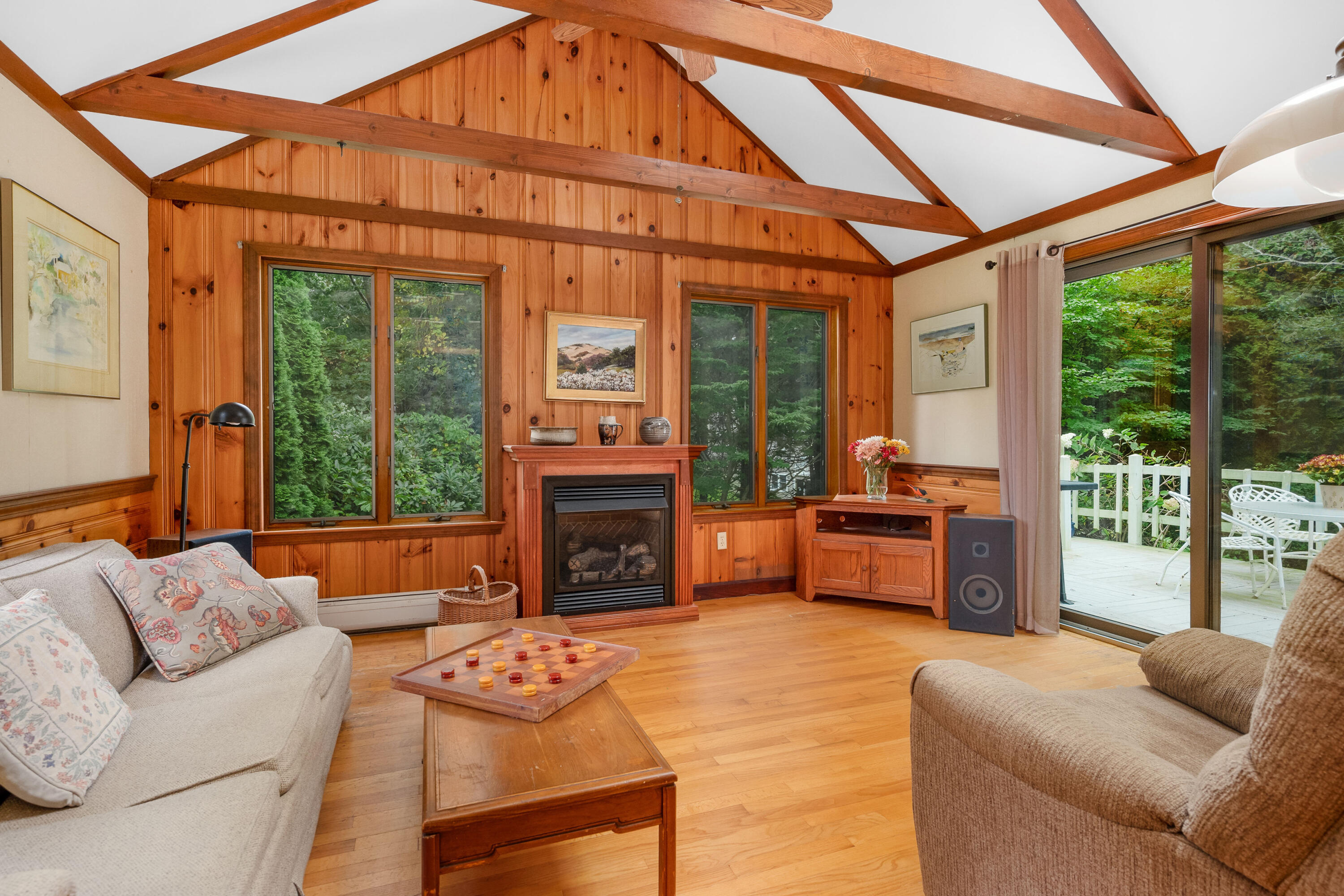 33 Oxner Road Centerville, MA 02632 - Photo 15 of 26 a living room with furniture a fireplace and floor to ceiling windows