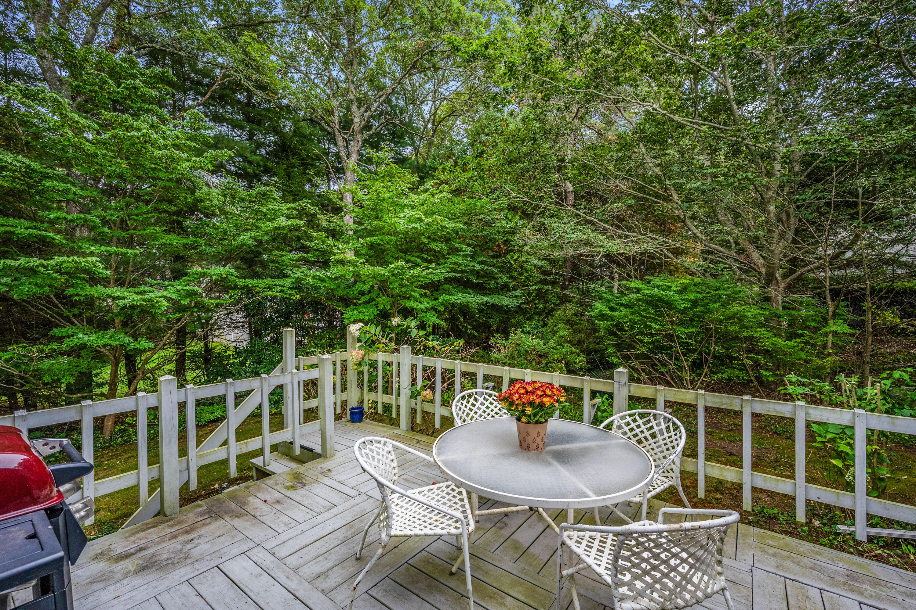 33 Oxner Road Centerville, MA 02632 - Photo 23 of 26 a deck with a table and chairs