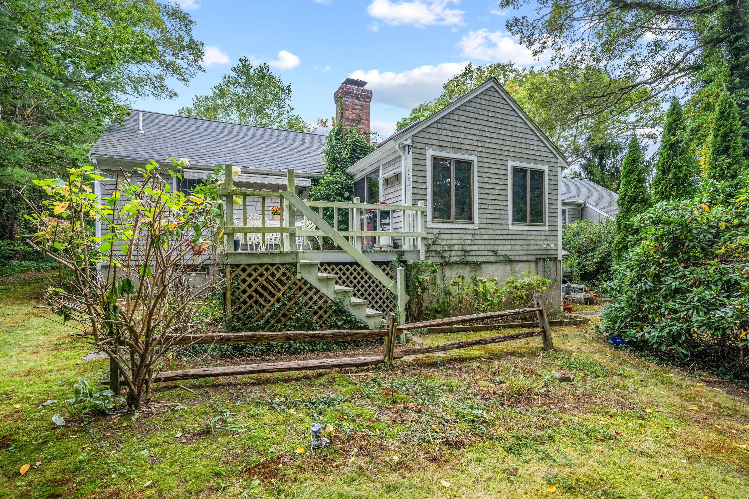 33 Oxner Road Centerville, MA 02632 - Photo 24 of 26 a front view of a house with a yard