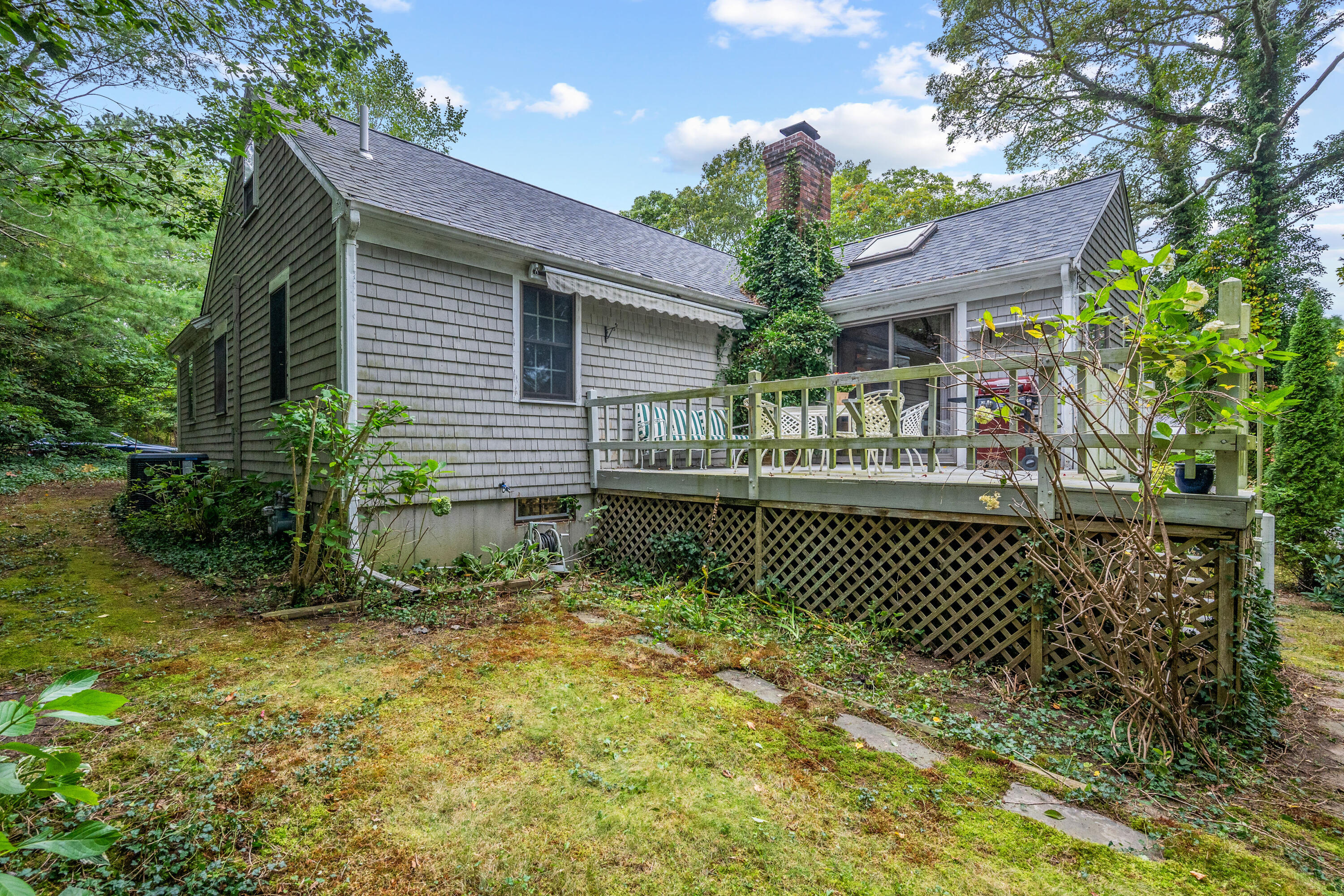 33 Oxner Road Centerville, MA 02632 - Photo 25 of 26 a front view of a house with a garden