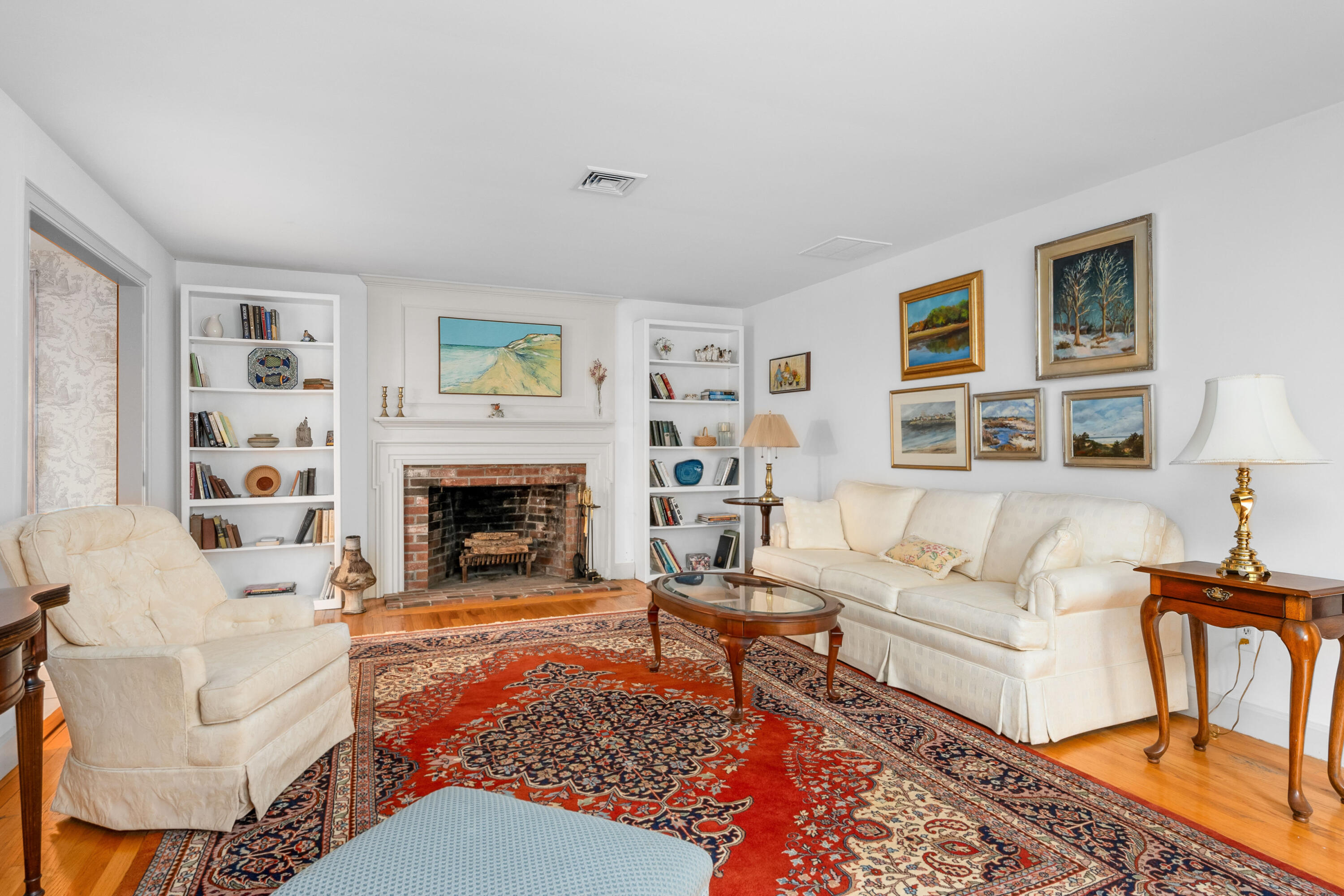 33 Oxner Road Centerville, MA 02632 - Photo 5 of 26 a living room with furniture and a fireplace