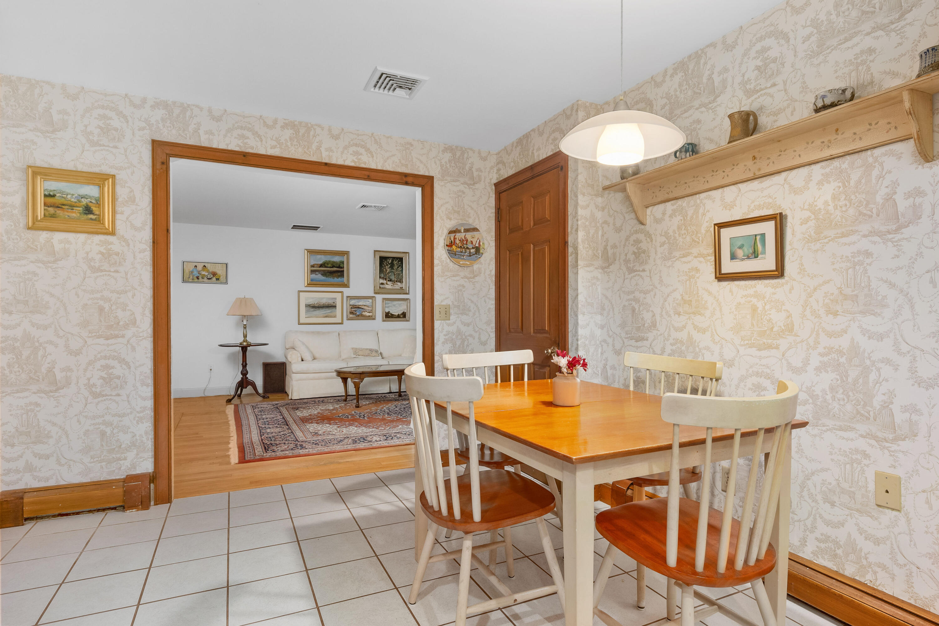 33 Oxner Road Centerville, MA 02632 - Photo 8 of 26 a view of a dining room with furniture and chandelier