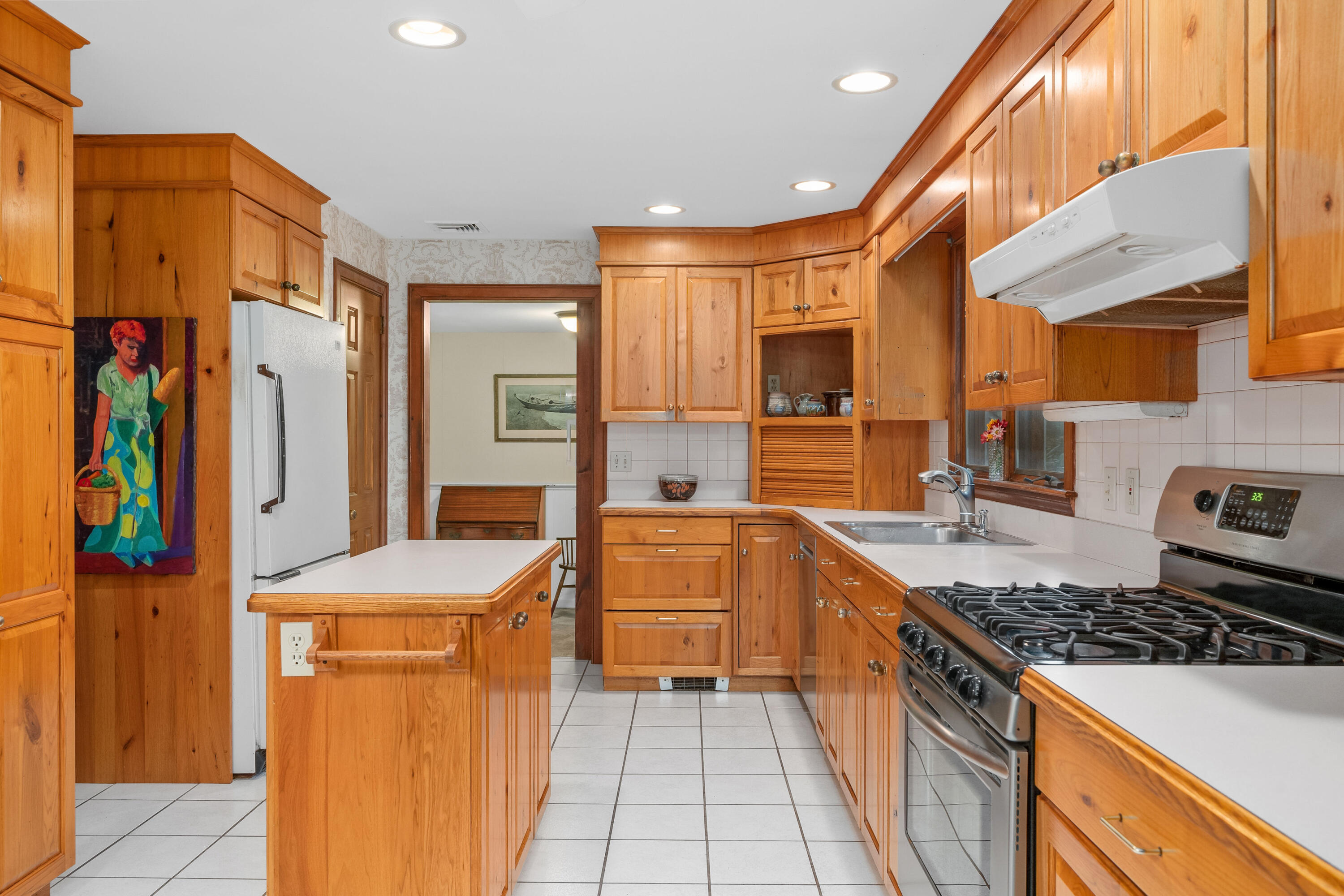 33 Oxner Road Centerville, MA 02632 - Photo 10 of 26 a kitchen with stainless steel appliances a stove a sink and a refrigerator