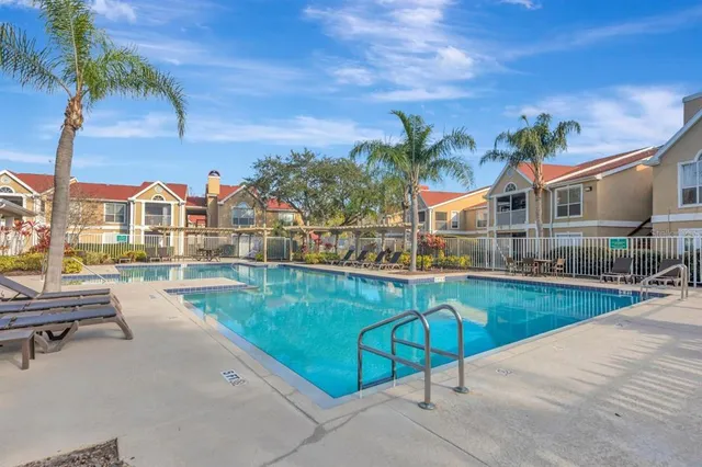 a view of swimming pool with outdoor seating