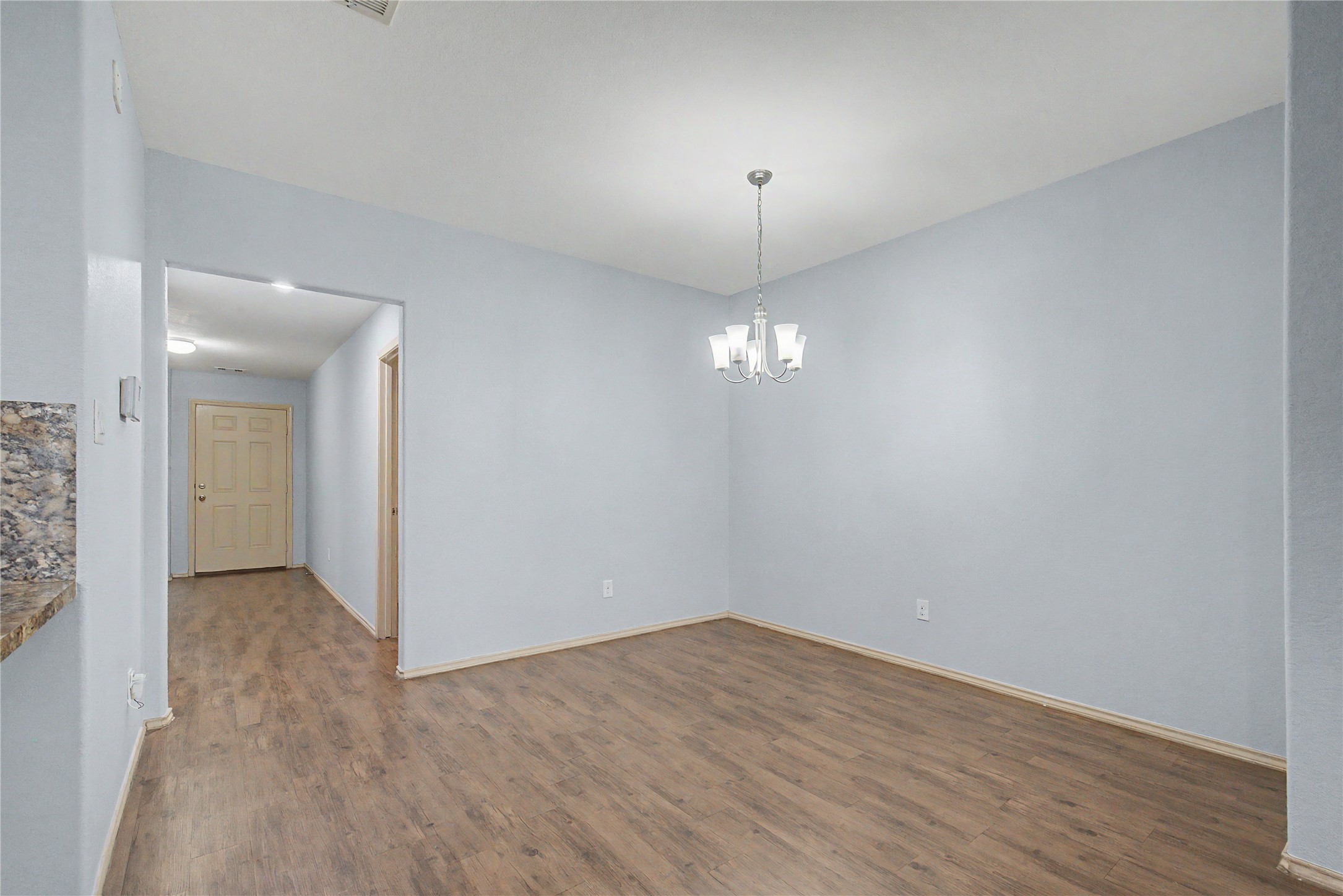 16430 Rodeo River Road Houston, TX 77049 - Photo 17 of 34 a view of empty room with wooden floor