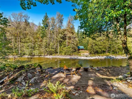 a view of a sign board with a yard