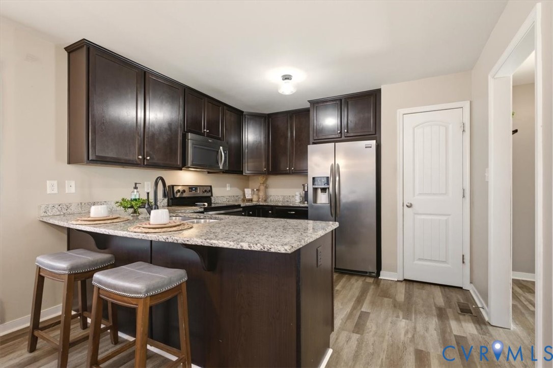 5312 Old Glory Road Chesterfield, VA 23832 - Photo 14 of 48 a kitchen with a refrigerator and a sink