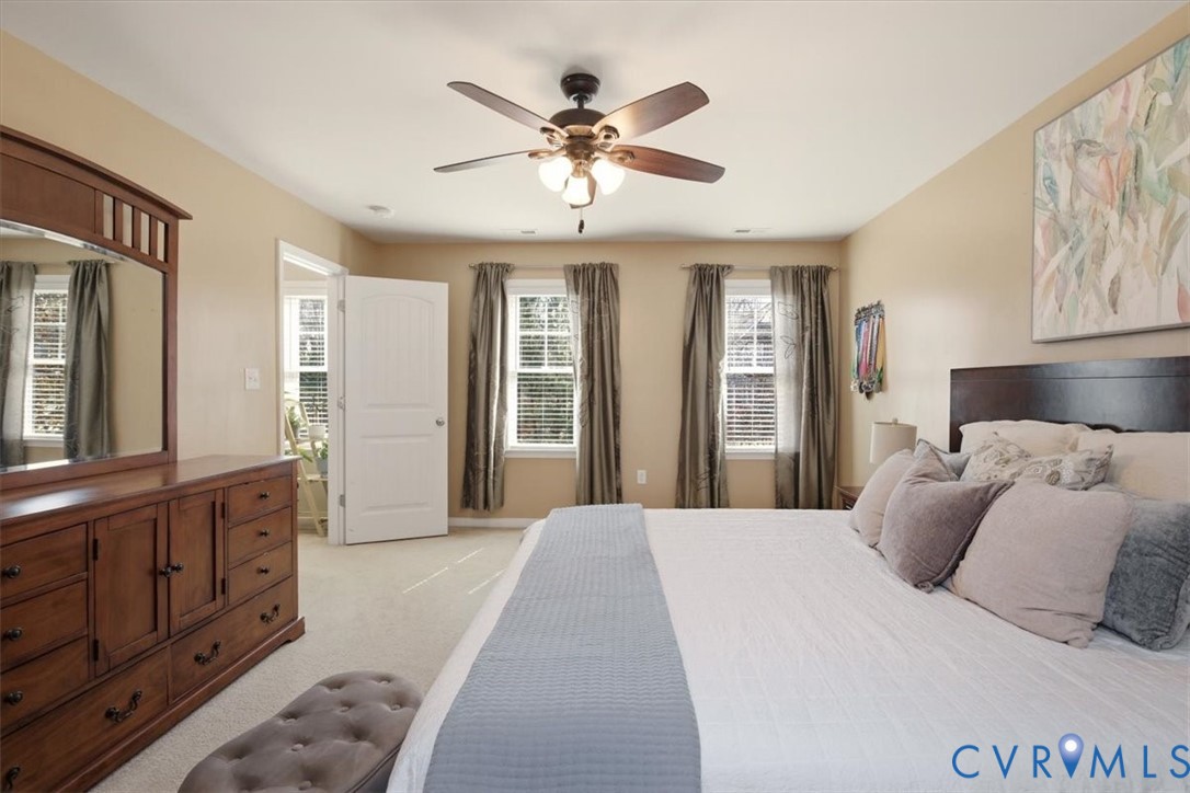 5312 Old Glory Road Chesterfield, VA 23832 - Photo 27 of 48 a bedroom with a large bed and ceiling fan