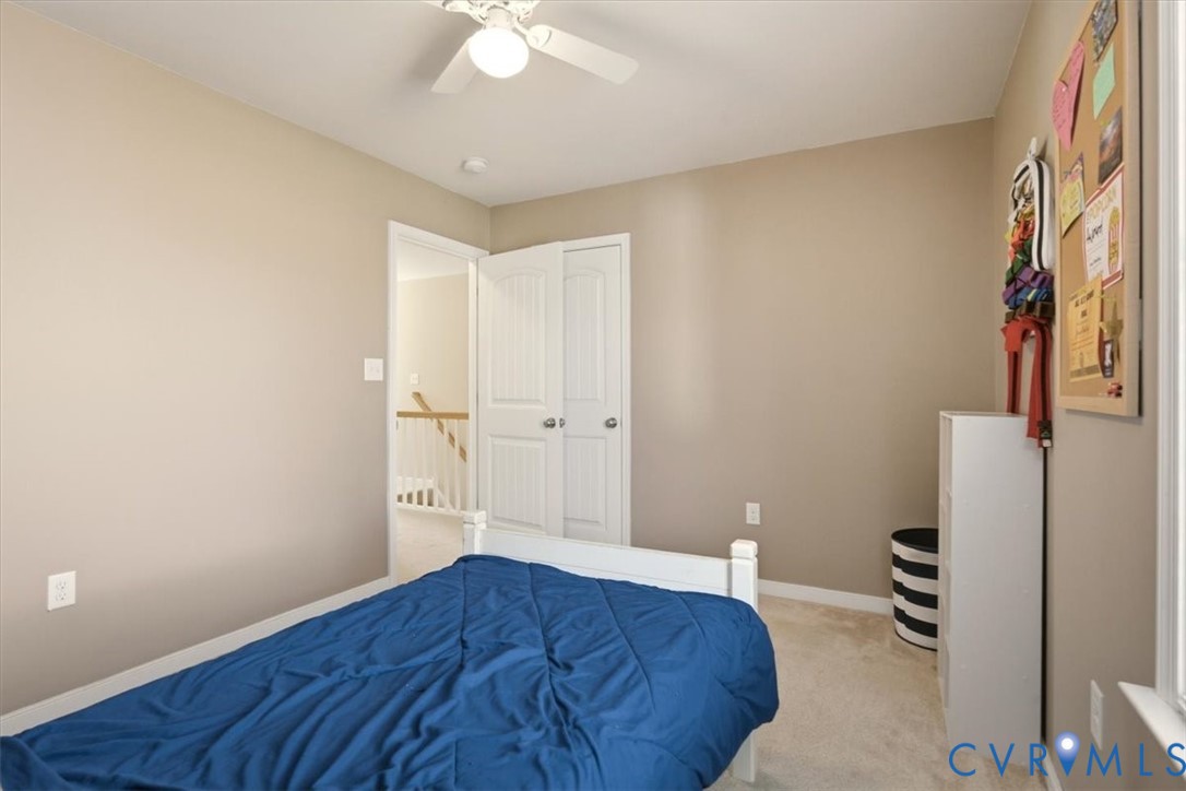 5312 Old Glory Road Chesterfield, VA 23832 - Photo 34 of 48 a bedroom with a bed and a lamp on the dresser