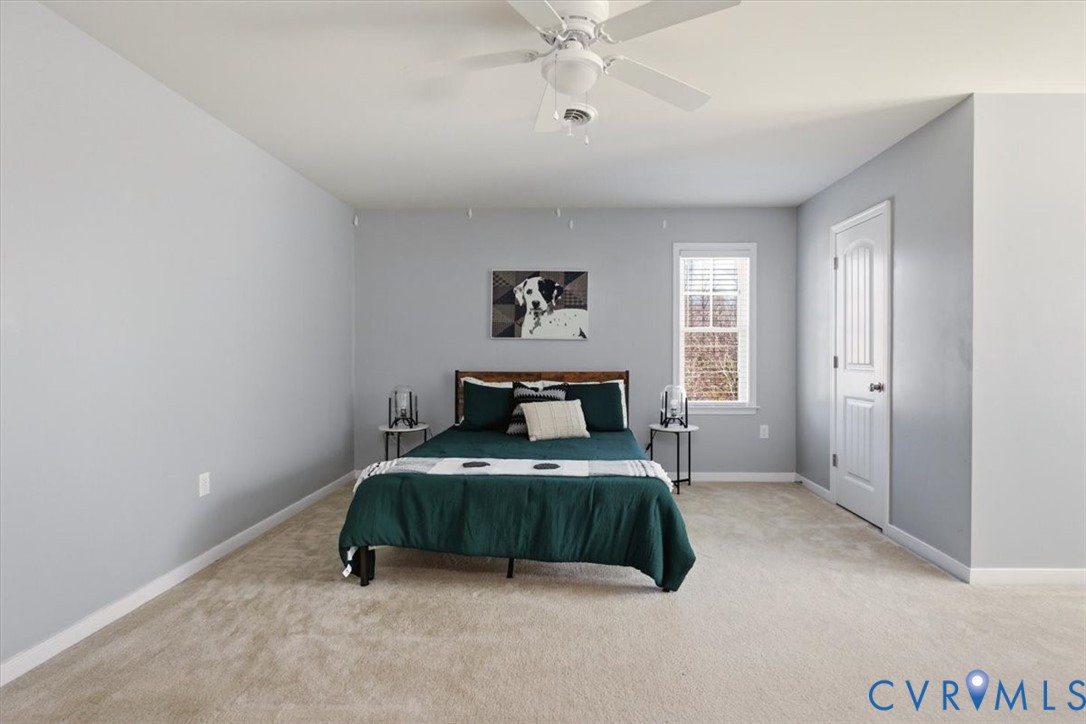 5312 Old Glory Road Chesterfield, VA 23832 - Photo 39 of 48 a bedroom with a bed and a chandelier