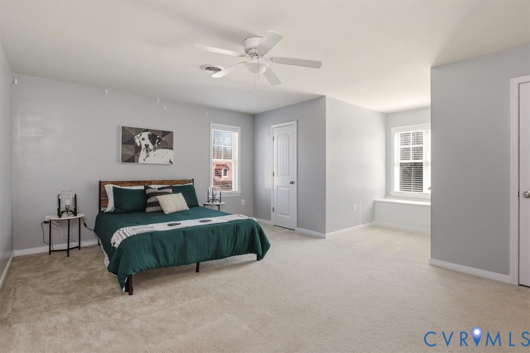 5312 Old Glory Road Chesterfield, VA 23832 - Photo 40 of 48 a bedroom with a bed and a chandelier