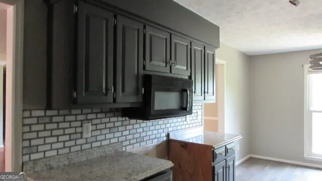 a bathroom with a sink a mirror and window