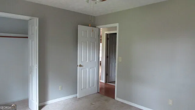 a view of a hallway with closet