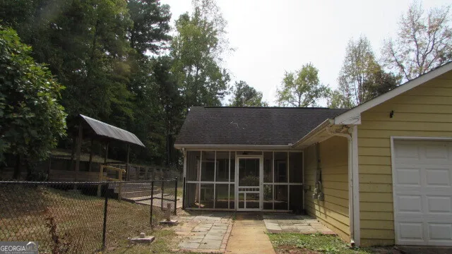 a front view of house with a garden