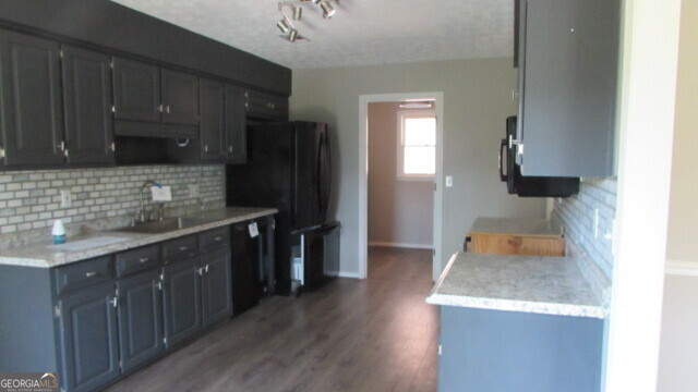 40 River Point Drive LaGrange, GA 30240 - Photo 9 of 17 a kitchen with wooden cabinets and a sink