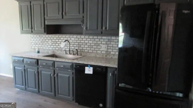 a bathroom with a sink and a cabinets