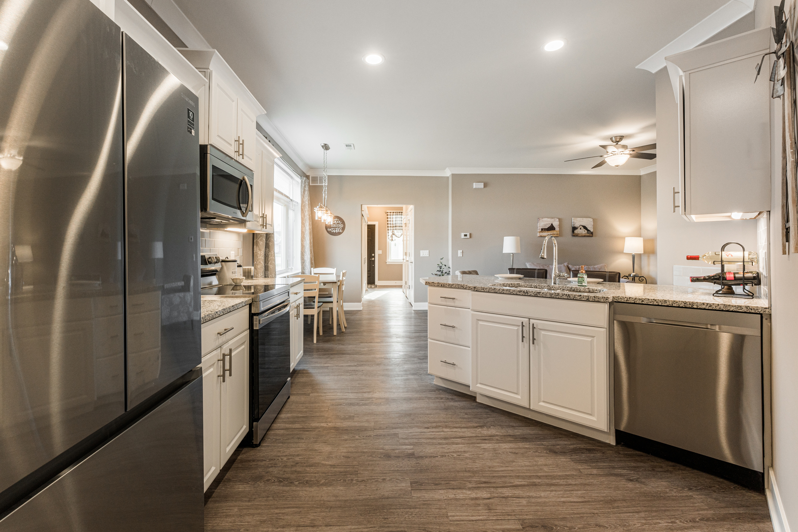 108 Boulder Court, Unit 108 Genoa, IL 60135 - Photo 7 of 25 a large kitchen with stainless steel appliances and a refrigerator