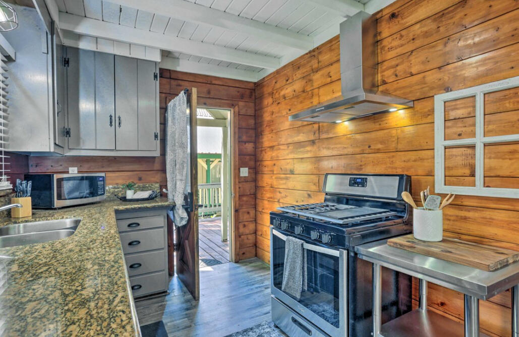 42036 Tollhouse Road Shaver Lake, CA 93664 - Photo 6 of 30 a kitchen with stainless steel appliances granite countertop a stove and a refrigerator
