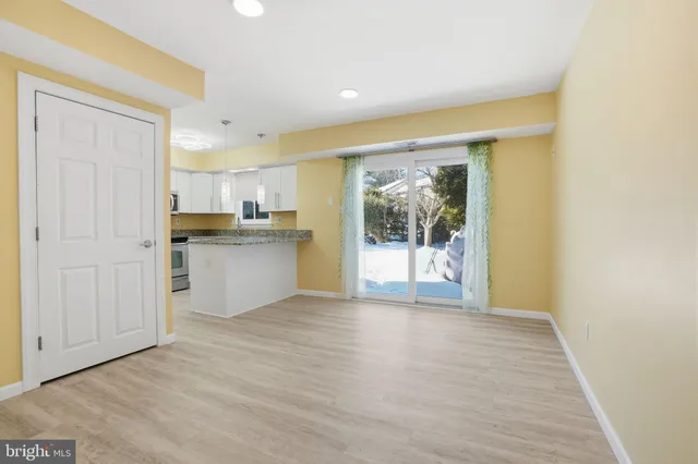 a view of a kitchen with a stove top oven