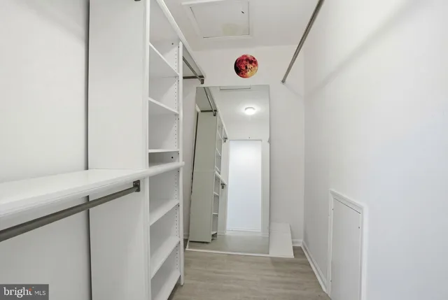a bathroom with a granite countertop sink a toilet and a mirror