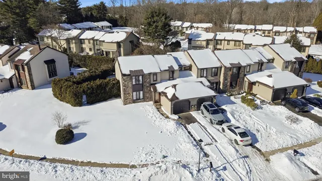 a roof deck with table and chairs