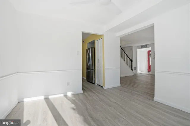 a view of a room with wooden floor