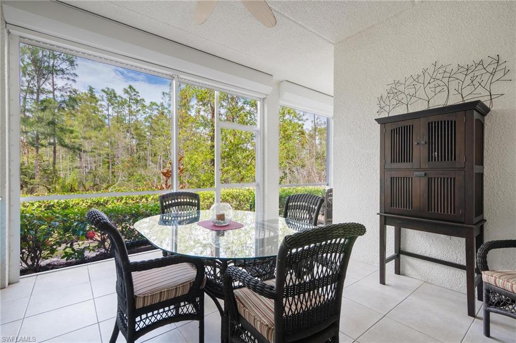 a view of a dining room with furniture window and outside view