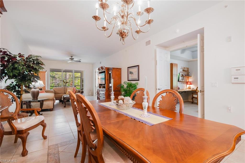 14565 Red Fox Run, Unit 613 Naples, FL 34110 - Photo 13 of 48 a dining room with furniture and window
