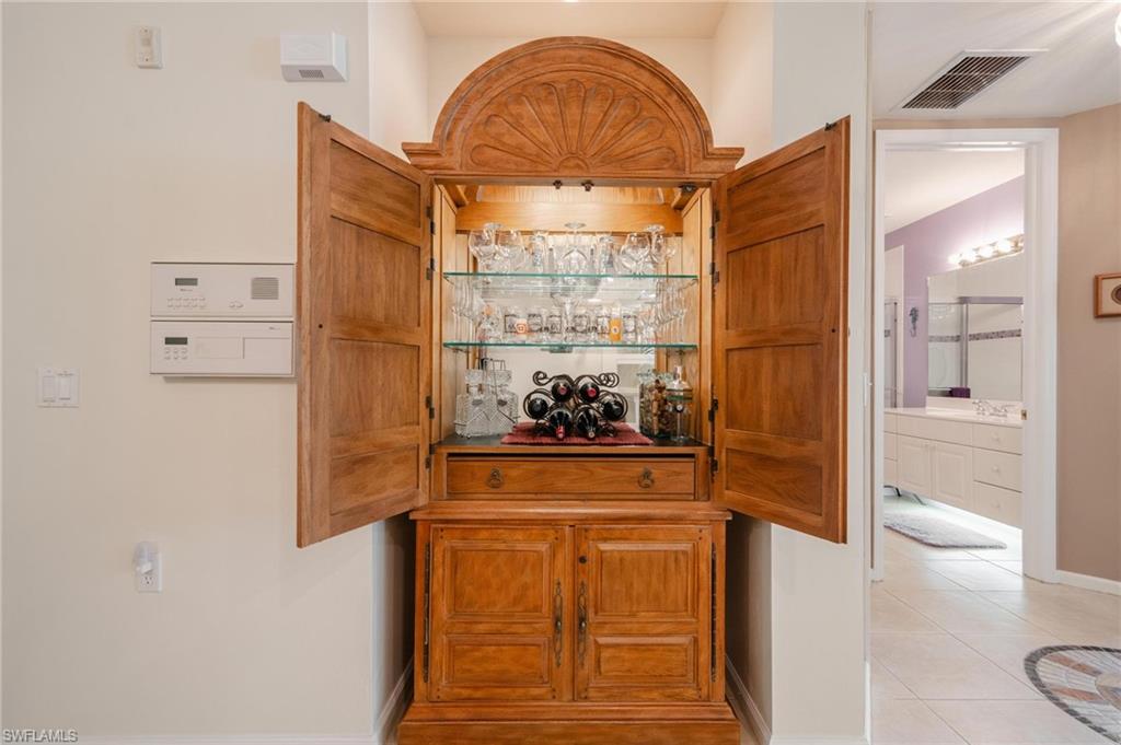 14565 Red Fox Run, Unit 613 Naples, FL 34110 - Photo 14 of 48 a view of front door with wooden floor