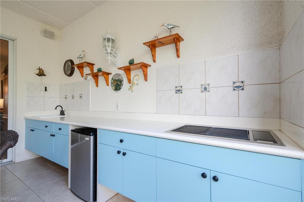 14565 Red Fox Run, Unit 613 Naples, FL 34110 - Photo 24 of 48 a bathroom with a sink and a mirror